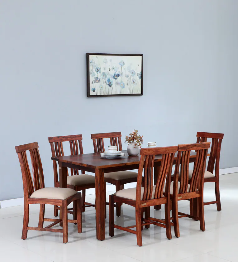 Solid wood dining table with six chairs, ideal for family dining rooms