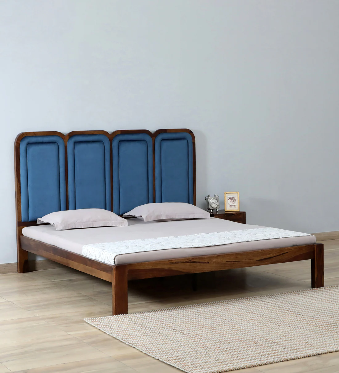 Wooden bed with tall headboard and smooth polished finish, premium solid wood bed for modern bedroom