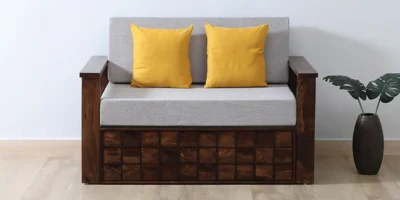 Elegant sofa cum bed featuring tufted backrest design, ample hidden storage space, and sturdy frame for modern living rooms.