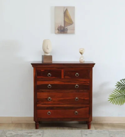 Classic chest of drawers crafted from solid Sheesham wood with wide storage space and elegant polished surface.