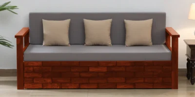 Modern convertible sofa cum bed with strong wooden frame and soft fabric upholstery, perfect for seating and guest sleeping.