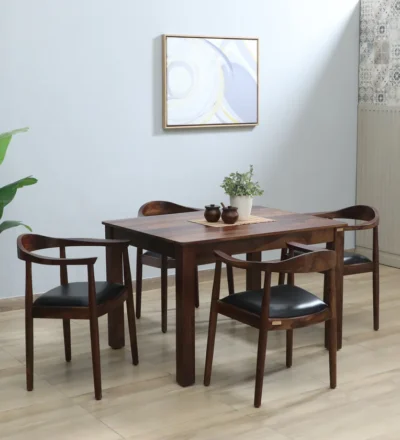 Compact Sheesham dining furniture with four chairs and functional storage base.