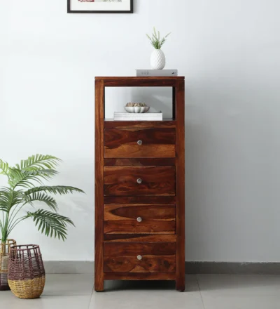 Solid Sheesham wood handcrafted chest of drawers featuring polished top and multiple storage compartments.