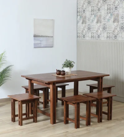 Spacious wooden dining table with six comfortable chairs, perfect for family meals