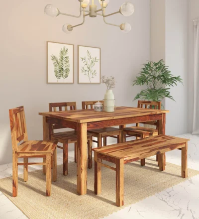 Premium Sheesham wood dining table with bench seating and four matching chairs.