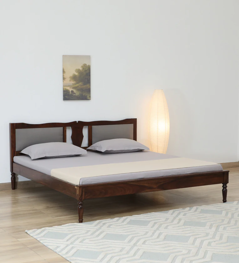 Wooden bed with tall slatted headboard and sturdy frame