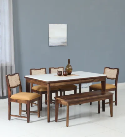 6-seater Sheesham wood dining set featuring durable tabletop and comfortable fabric seating.
